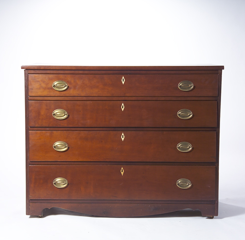 Appraisal: Georgian four-drawer walnut chest with over-hanging top oval brass pulls