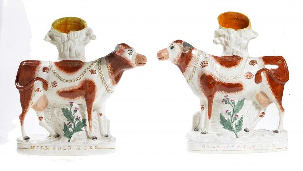 Appraisal: AN UNUSUAL PAIR OF STAFFORDSHIRE FLATBACK ADVERTISING SPILL HOLDERS in