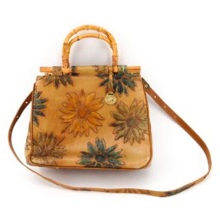 Appraisal: Brahmin Embossed Leather And Bamboo Flower Motif Handbag Fabric interior