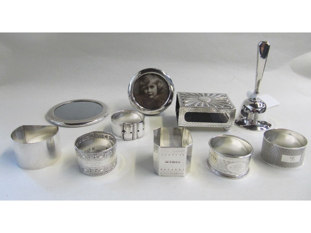 Appraisal: Lot comprising silver bell photo frame matchbox holder four silver