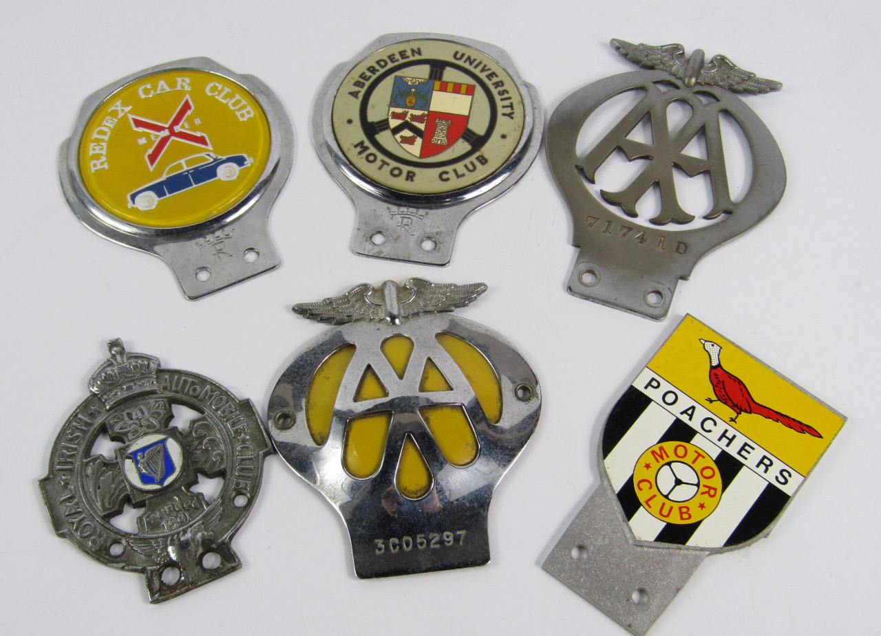 Appraisal: A collection of automobile club badges comprising a pre-war AA