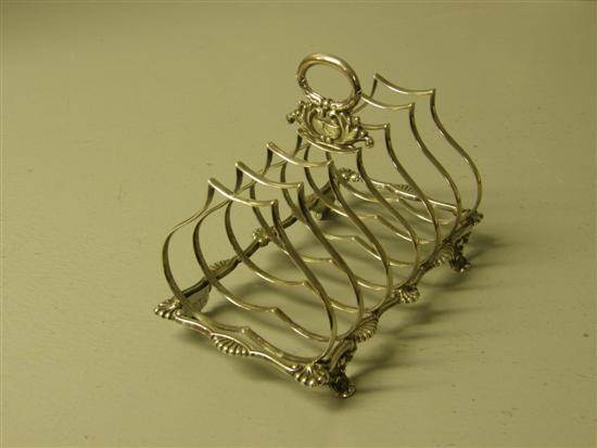 Appraisal: Edward VII silver toast rack with six shaped divisions ring