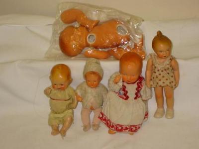 Appraisal: A sprayed bisque baby doll high another bisque baby doll