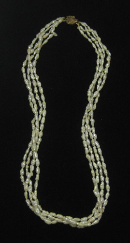 Appraisal: QUADRUPLE STRAND PEARL NECKLACE with four strands of rice pearls