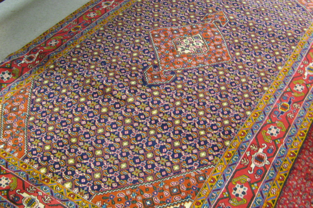 Appraisal: PERSIAN TABRIZ CARPET central geometric medallion and overall Herati floral