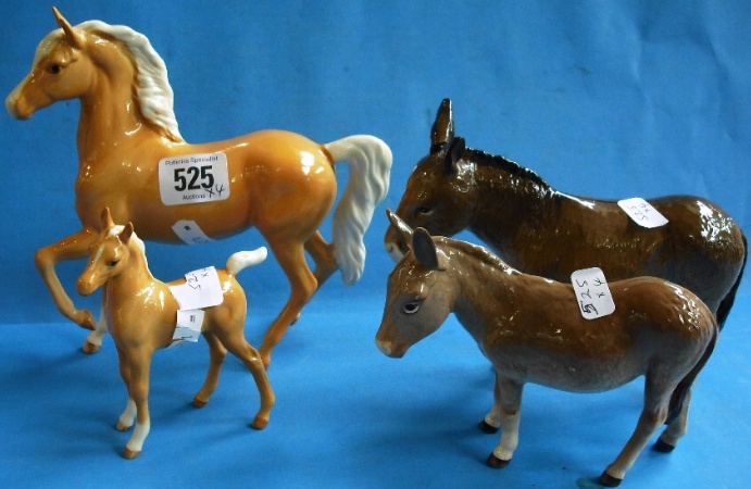 Appraisal: Beswick Donkey Donkey Palomino Foal and Royal Doulton Palomino Horse