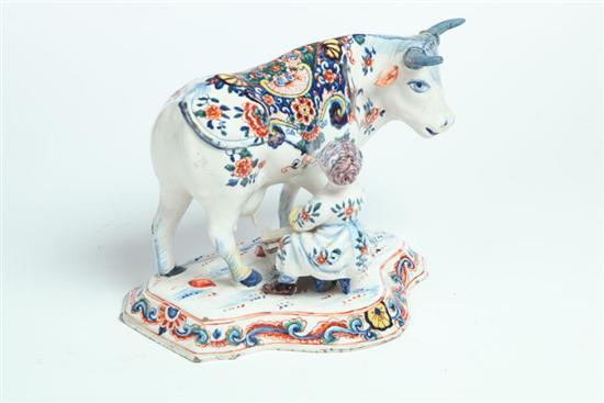 Appraisal: DELFT MILKMAID AND COW Netherlands th century tin glazed earthenware