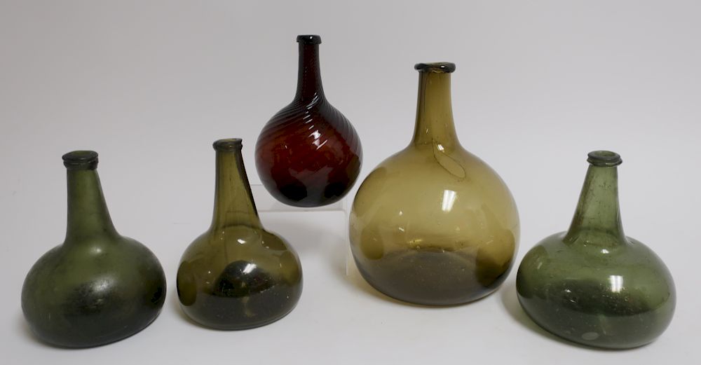 Appraisal: American Blown Glass Wine Bar Bottles th c one amber