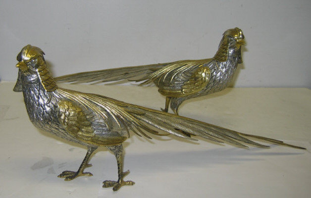 Appraisal: PAIR OF SILVER AND PARCEL GILT PHEASANT FIGURES Possibly French