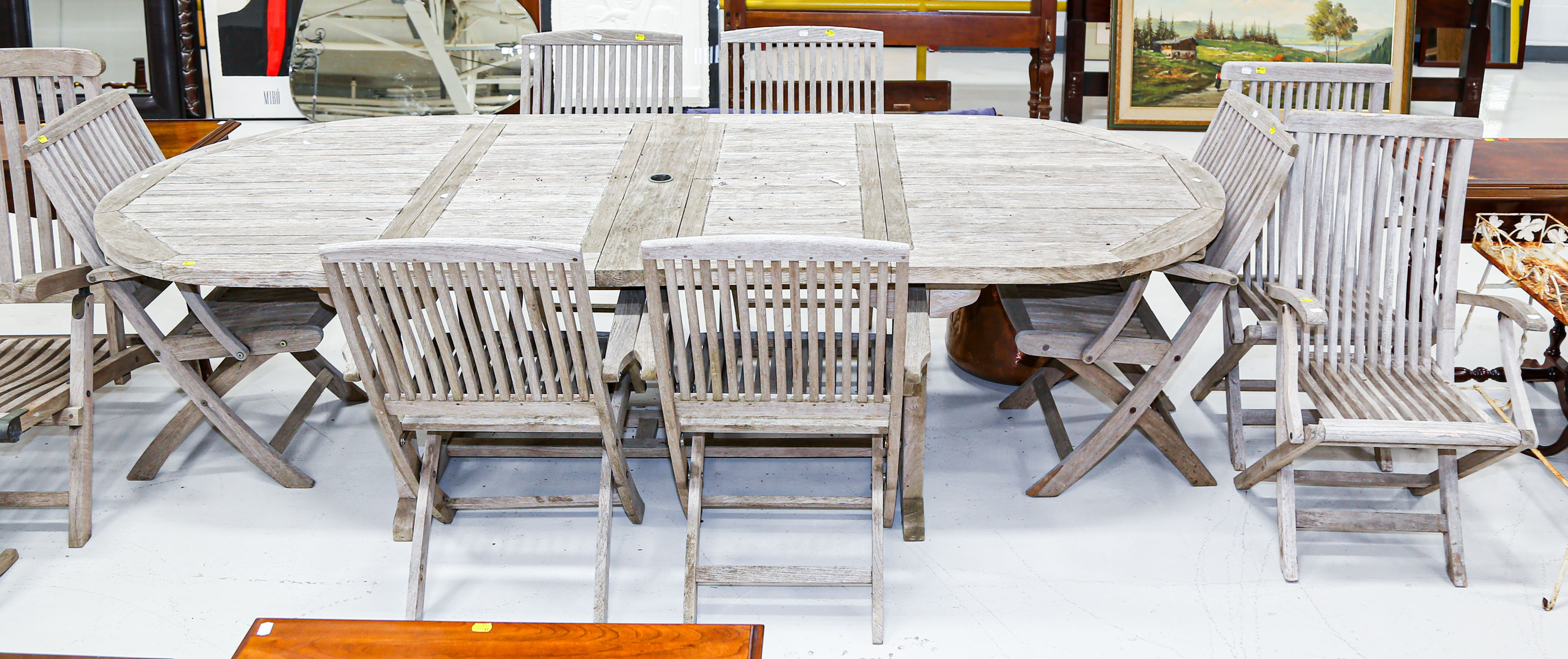 Appraisal: NINE-PIECE WOOD PATIO SET Including eight chairs table table is