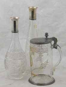 Appraisal: A pewter lidded glass tankard with wheel engraved and gilt