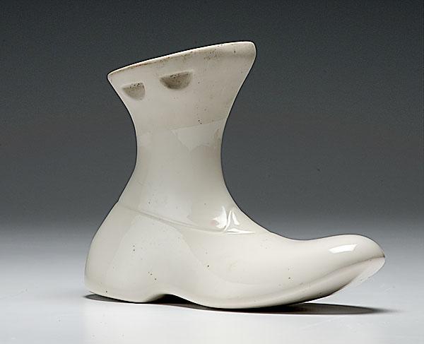 Appraisal: GLAZED PORCELAIN BOOT MOLD a glazed porcelain boot mold with