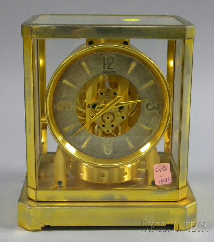 Appraisal: Brass and Glass Cased Atmos Clock by Le Coultre Switzerland