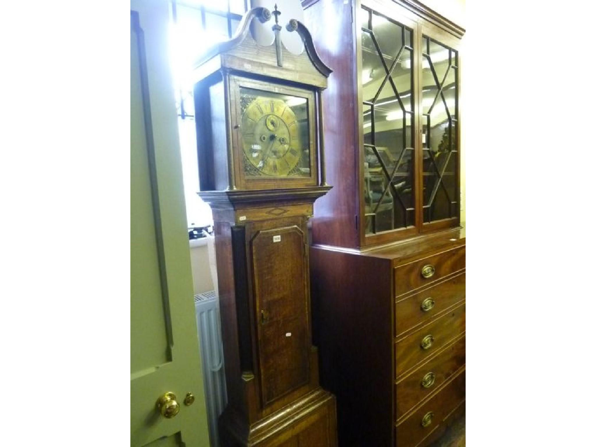 Appraisal: A Georgian oak longcase clock with walnut crossbanded detail the