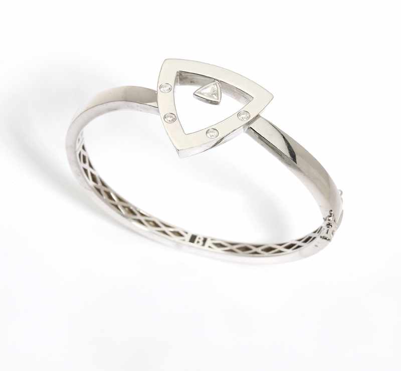 Appraisal: A diamond and white gold bangle K white gold set