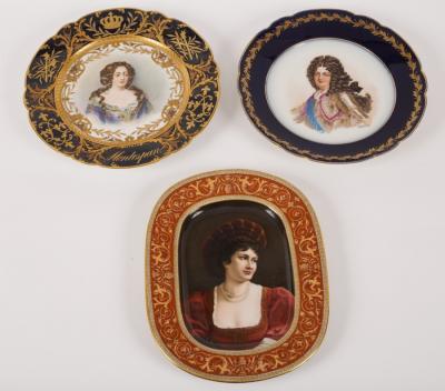 Appraisal: Two S vres style plates painted portraits of Louis XIV