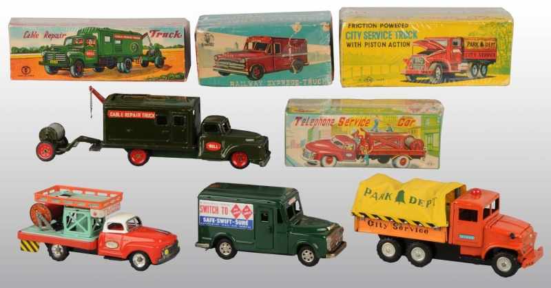 Appraisal: Lot of Tin Litho Truck Friction Toys Description Japanese Working