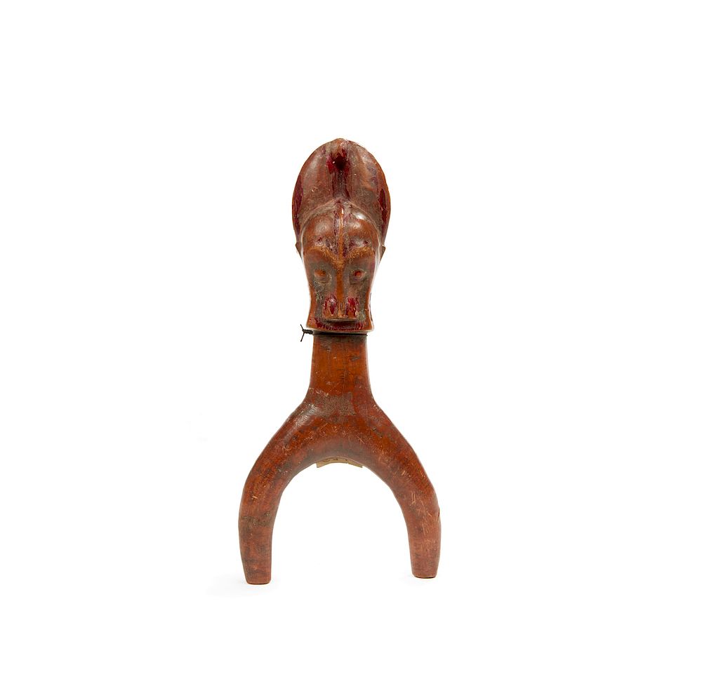 Appraisal: Baule Slingshot Baule dark brown wood slingshot with two buffalo