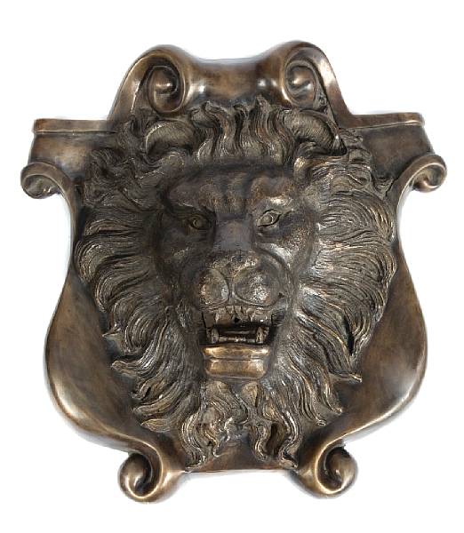 Appraisal: A patinated bronze fountain head of a lion height in