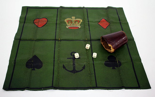 Appraisal: AN OLD GAMBLING GAME the canvas board divided into six