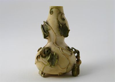 Appraisal: A Chinese ivory miniature vase carved as a large gourd