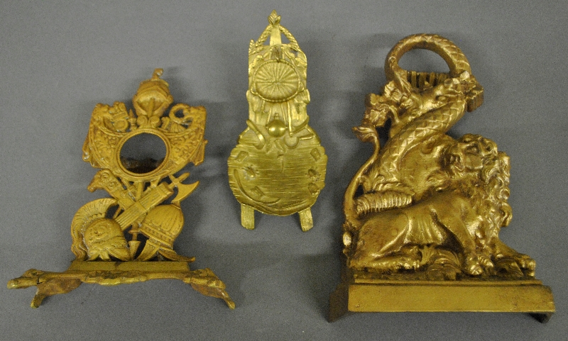 Appraisal: - Two brass watch holders and an iron brass colored