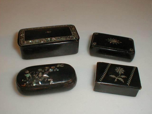 Appraisal: Four thC inlaid papier mach snuff boxes