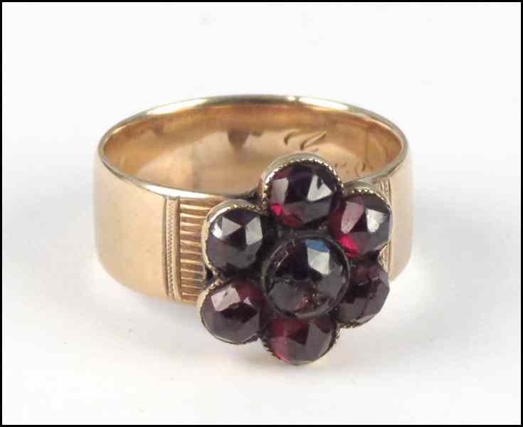 Appraisal: VICTORIAN GARNET AND KARAT YELLOW GOLD RING Seven almandite garnets