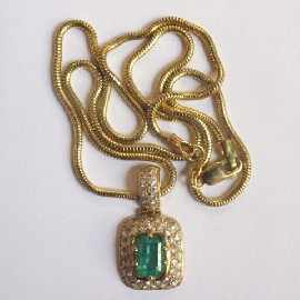 Appraisal: An ct gold emerald and diamond pendant on an ct