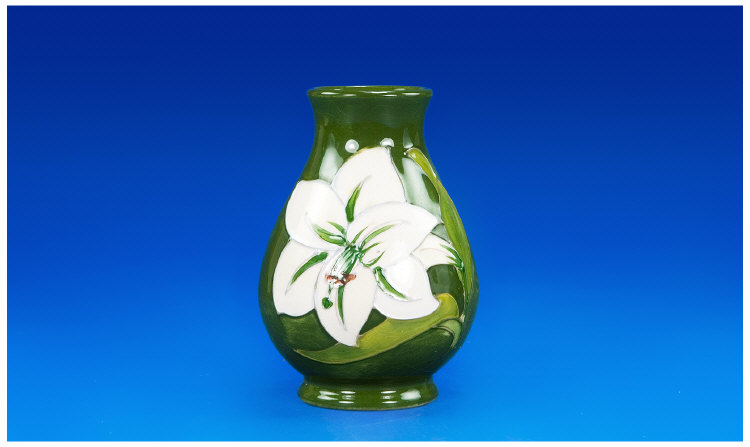 Appraisal: Moorcroft Small Vase Lilies on Green Ground Stands inches in