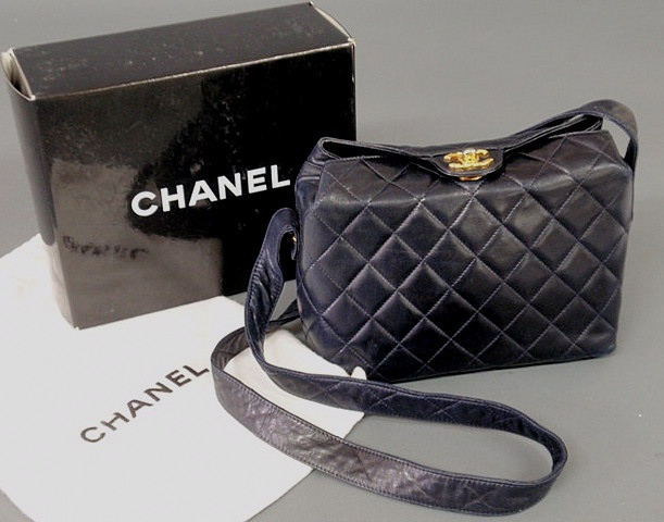 Appraisal: Chanel navy quilted leather bag with top clasp gold tone