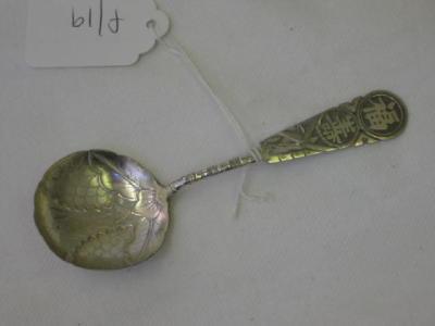 Appraisal: A CHINESE CADDY SPOON the circular bowl moulded with leaves