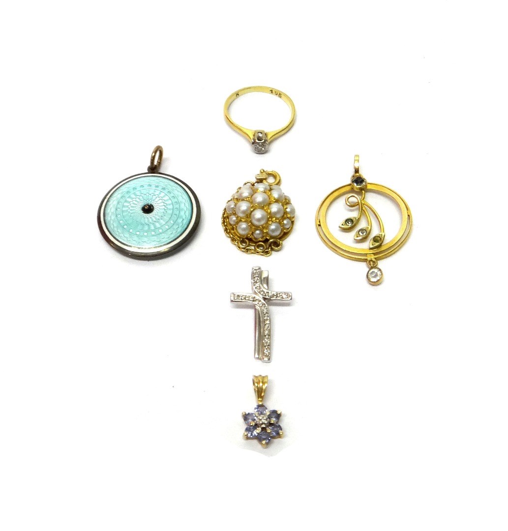 Appraisal: A pale blue and white enamelled circular pendant a gold