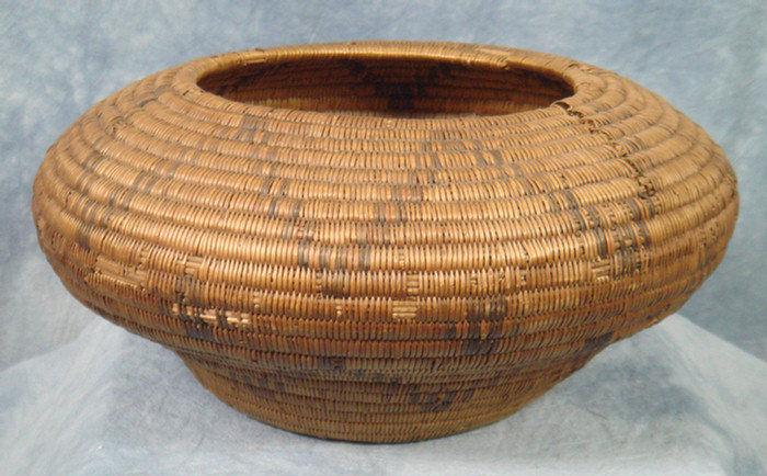 Appraisal: Coiled Native American basket with geometric design some losses and