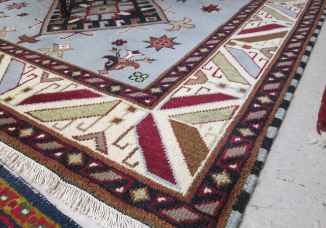 Appraisal: HAND KNOTTED ORIENTAL CARPET Indo-Caucasian overall geometric design on light