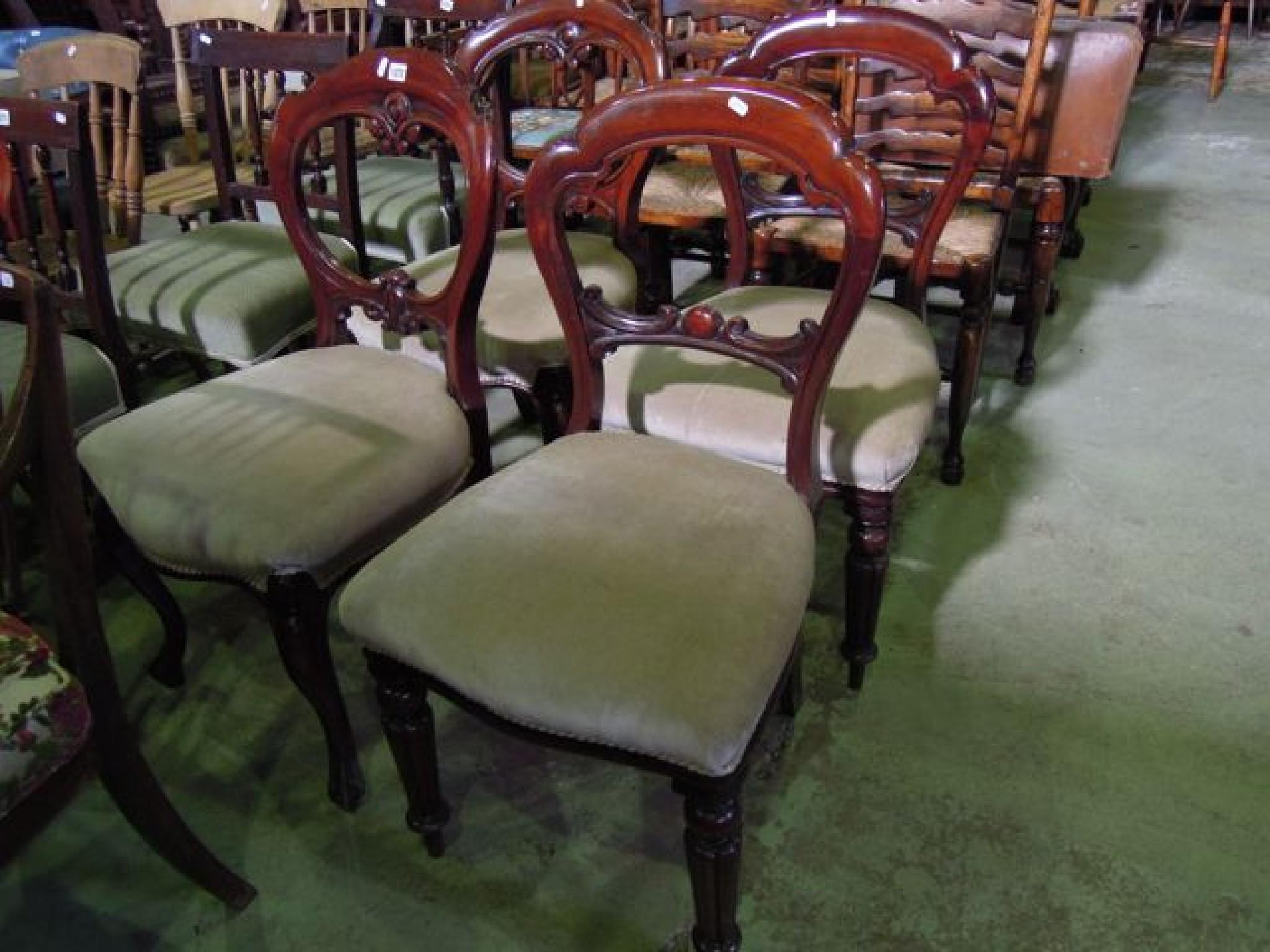 Appraisal: Four Victorian mahogany balloon back dining chairs with shaped carved