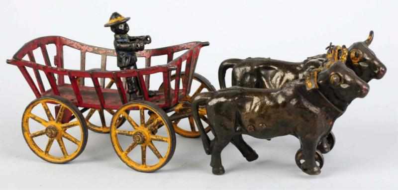 Appraisal: Cast Iron Ox-Drawn Hay Cart Toy Includes original African American