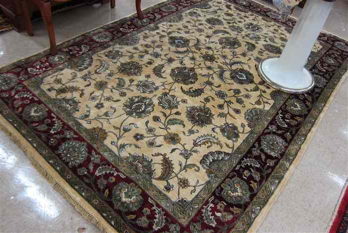 Appraisal: HAND KNOTTED ORIENTAL CARPET Persian Isfahan floral vine design on