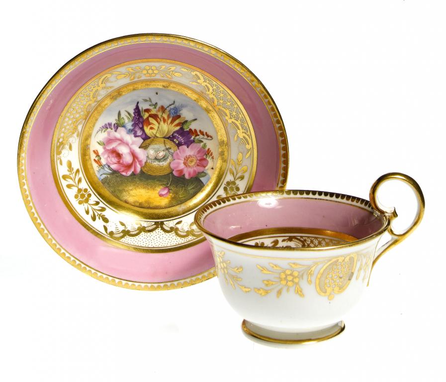 Appraisal: A COALPORT TEACUP AND SAUCER with kidney shaped handle painted