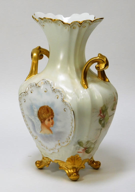 Appraisal: FRENCH LIMOGES GILT ENAMELED CHERUB VASE France Early th CenturyAmphora