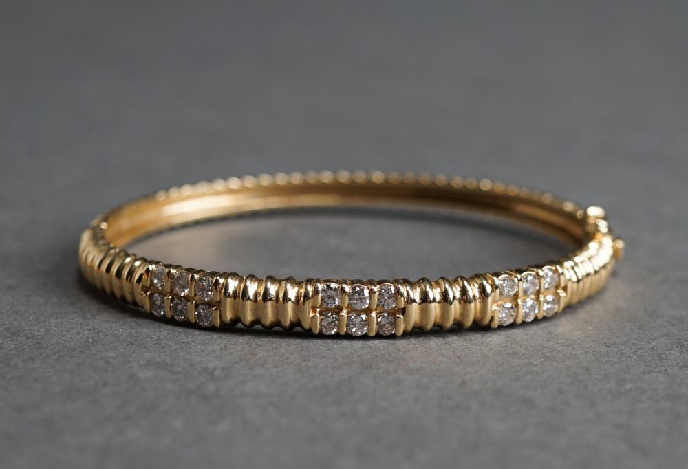 Appraisal: -Karat Yellow-Gold and Diamond Bangle Bracelet Having eighteen diamonds weighing