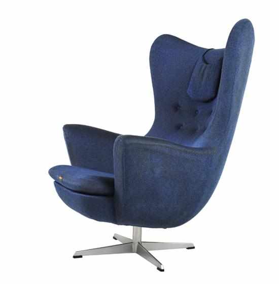 Appraisal: A WINGBACK SWIVEL CHAIR c cast aluminium fabric label to