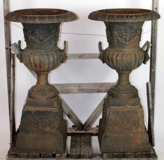 Appraisal: Pair of cast iron double handled garden urns A pair