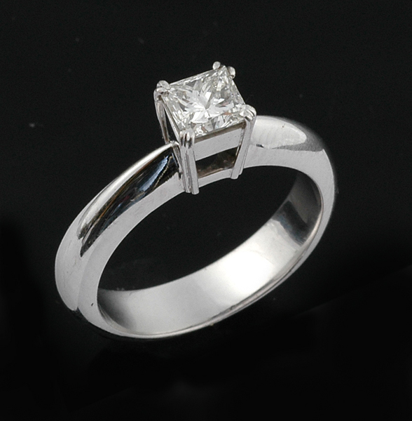 Appraisal: A diamond solitaire ring The princess cut diamond weighing cts