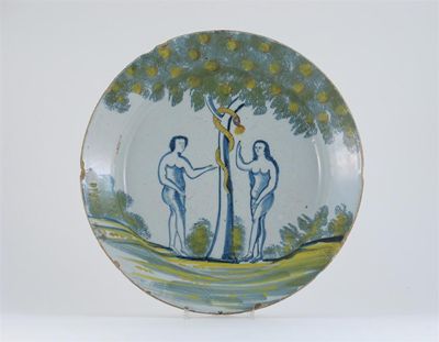 Appraisal: A Delftware Adam and Eve charger painted in polychrome with