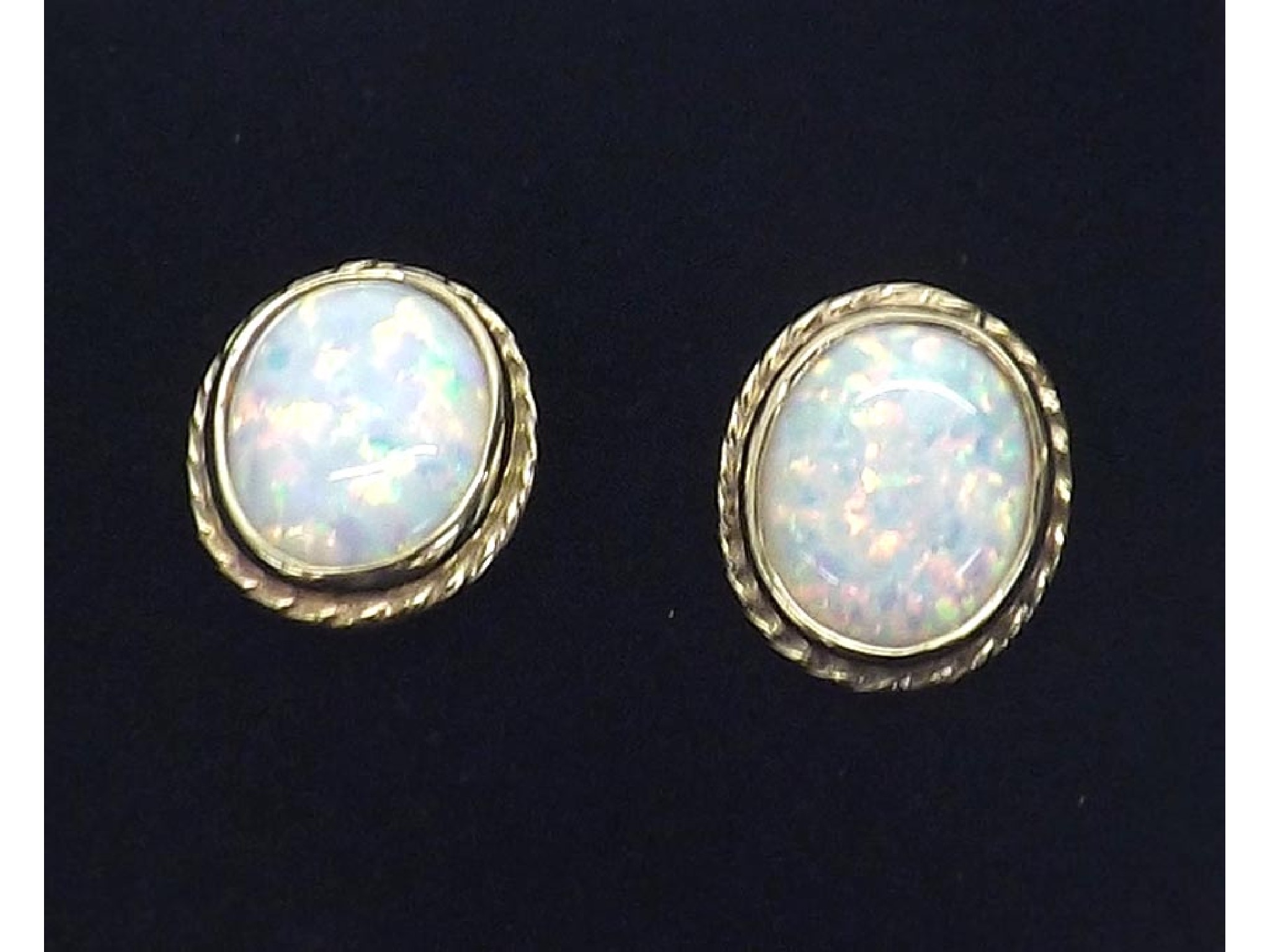 Appraisal: Pair of ct opal oval ear studs in yellow gold