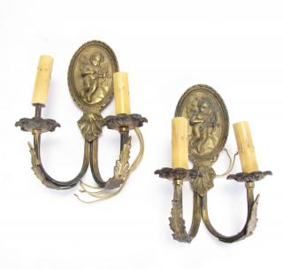 Appraisal: Description Pair of Bronze Wall Sconces medallion form with cherub