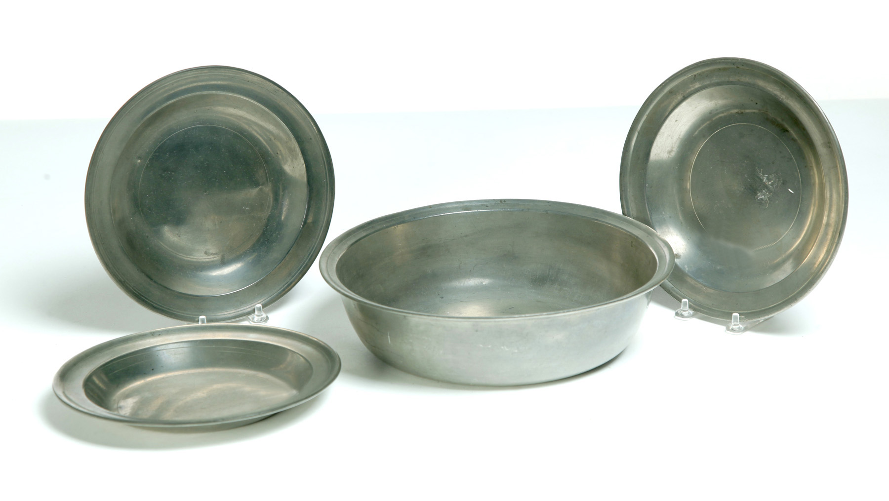 Appraisal: THREE PEWTER SOUP PLATES AND A BASIN Philadelphia late th