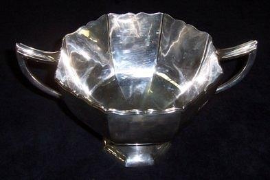 Appraisal: A twin-handled trophy cup of octagonal form on a pedestal