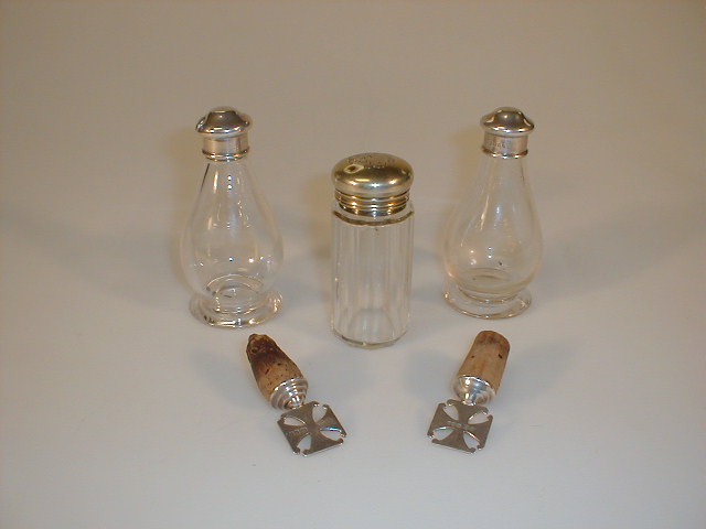 Appraisal: A pair of Ecclesiastical glass cruets with silver screw tops